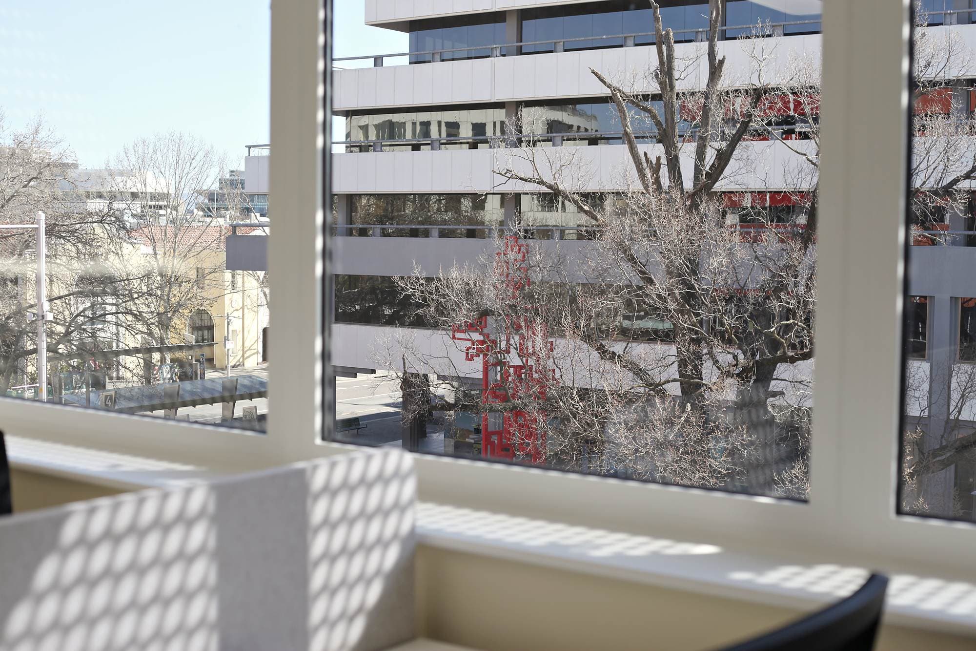 A desk by the window overlooking Canberra City